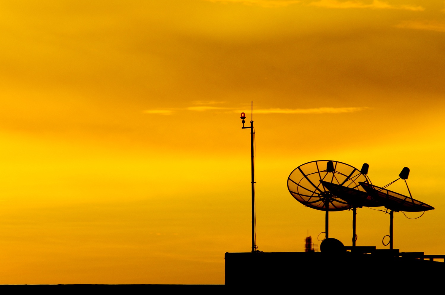 Satellite dish at sunset